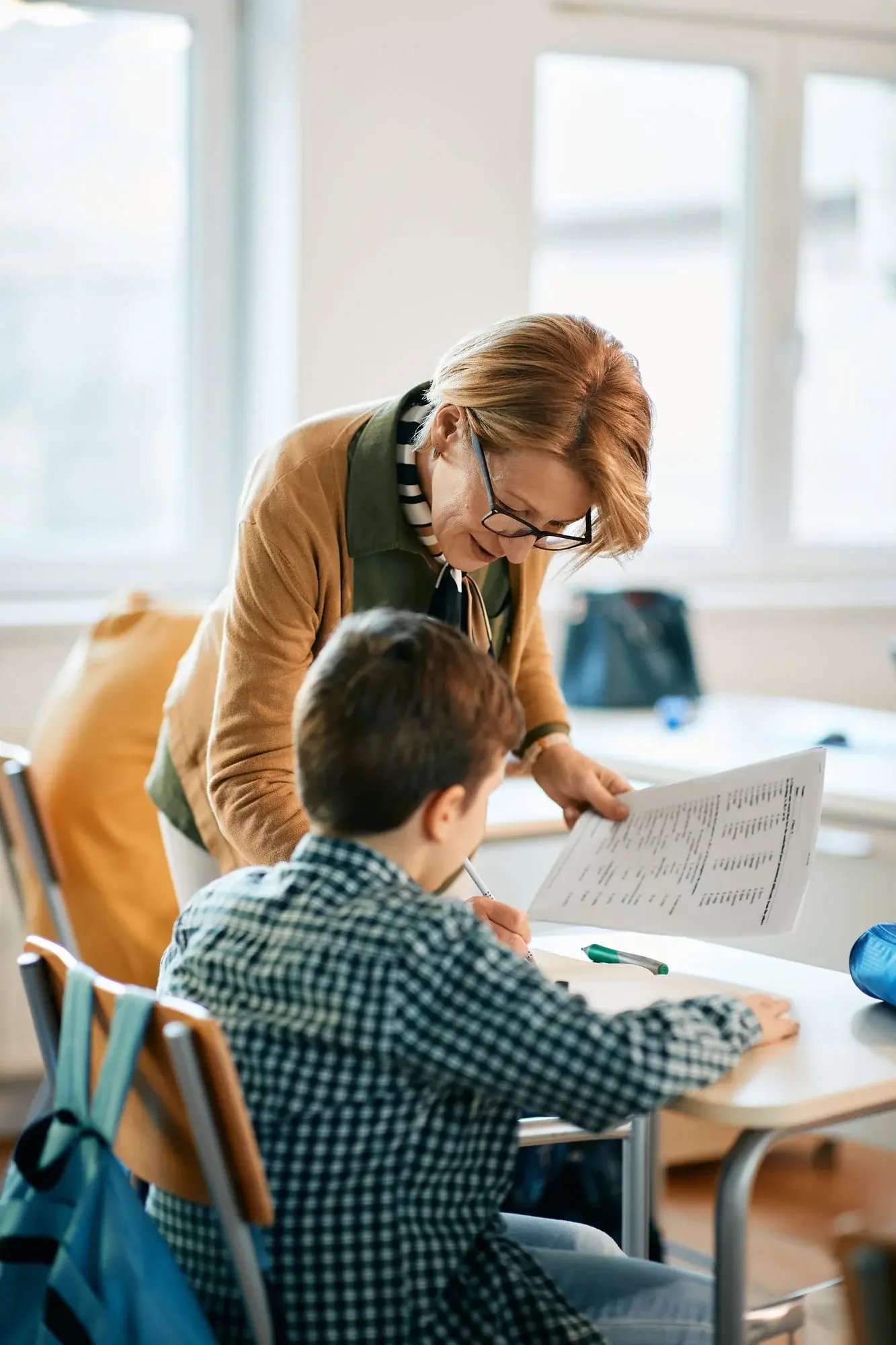 Educator assessing a student. 
